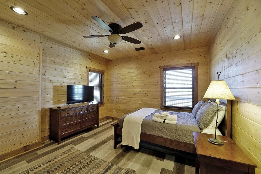 2175 Andes Ridge Talking Rock, GA 30175 - Photo 43 of 51 a bedroom with a bed and a flat screen tv