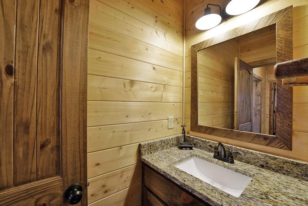 2175 Andes Ridge Talking Rock, GA 30175 - Photo 45 of 51 a bathroom with a granite countertop sink and a mirror