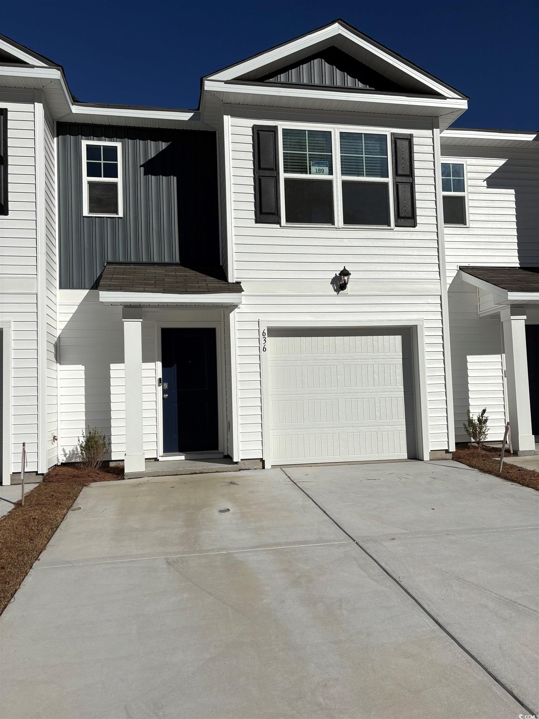 636 Golden Resin Road, Unit LOT 189 Conway, SC 29526 - Photo 1 of 40 View of front of house featuring board and batten siding, an attached garage, and driveway