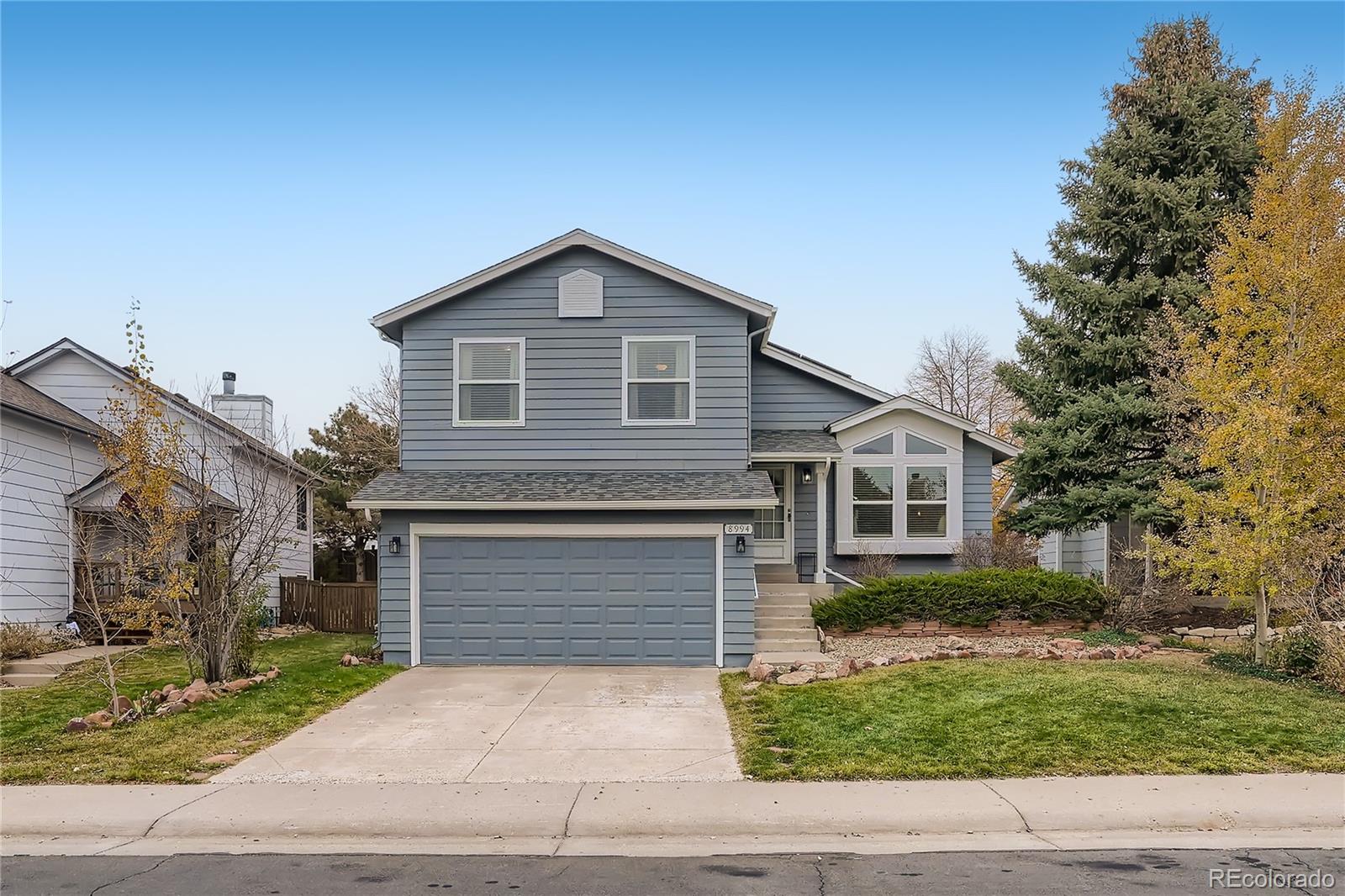 8994 Bermuda Run Circle Highlands Ranch, CO 80130 - Photo 1 of 30 a front view of a house with a yard