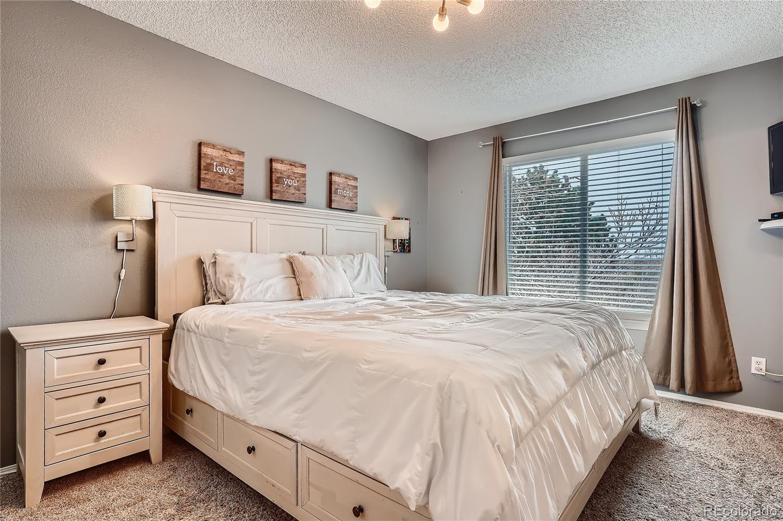 8994 Bermuda Run Circle Highlands Ranch, CO 80130 - Photo 14 of 30 a bedroom with a bed and a window
