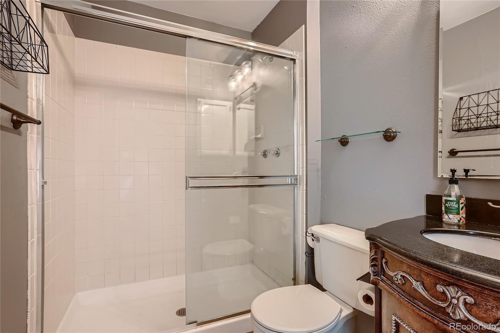 8994 Bermuda Run Circle Highlands Ranch, CO 80130 - Photo 16 of 30 a bathroom with a toilet and a shower