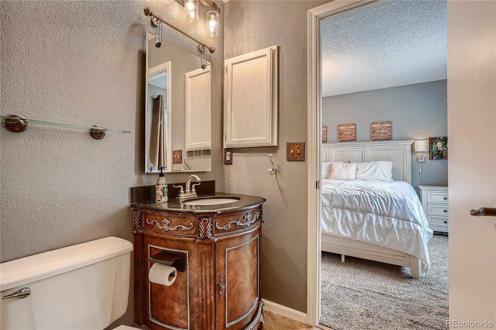 8994 Bermuda Run Circle Highlands Ranch, CO 80130 - Photo 17 of 30 a bedroom with a bed and a window