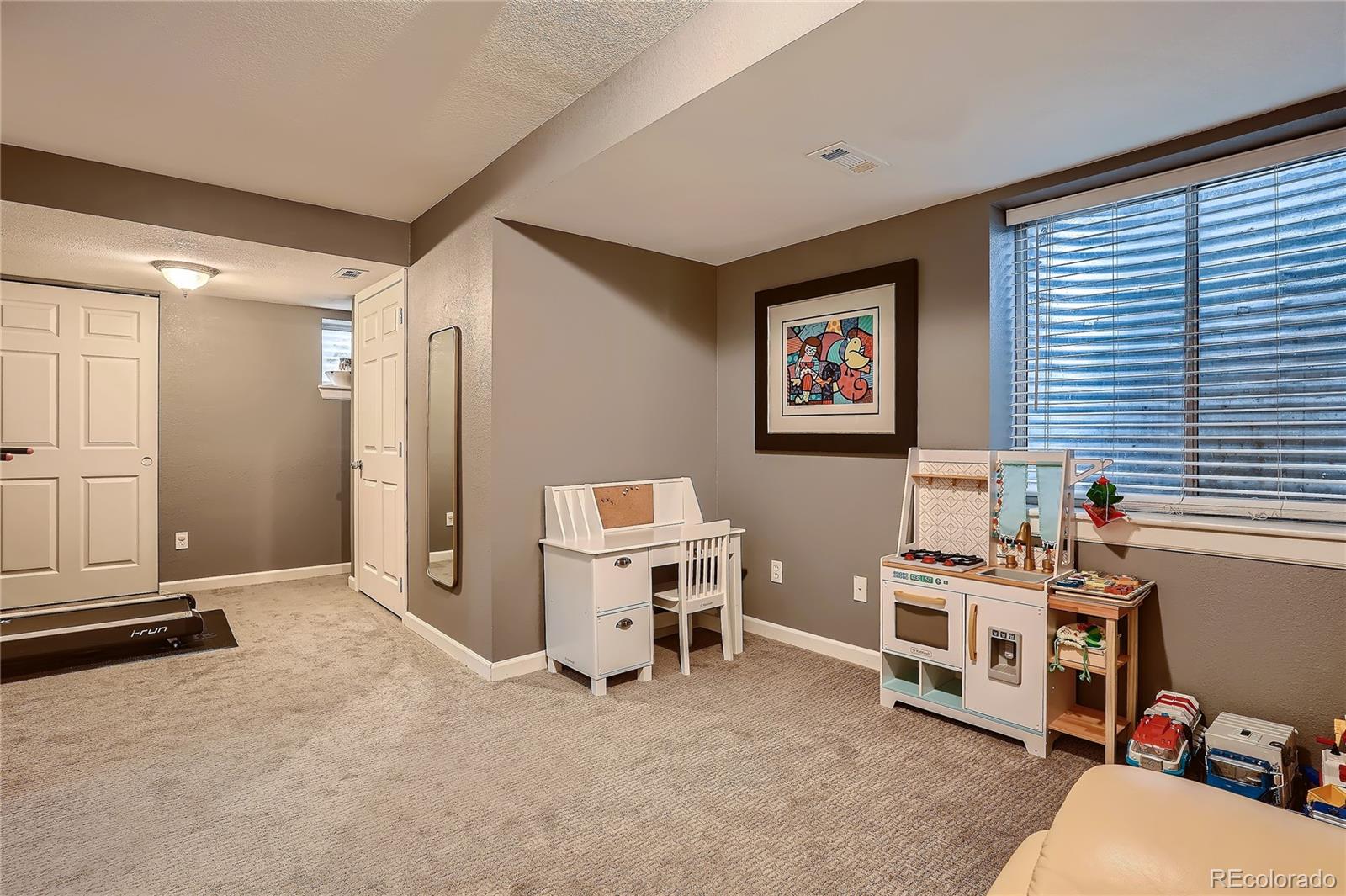 8994 Bermuda Run Circle Highlands Ranch, CO 80130 - Photo 24 of 30 a view of a workspace with furniture and a window