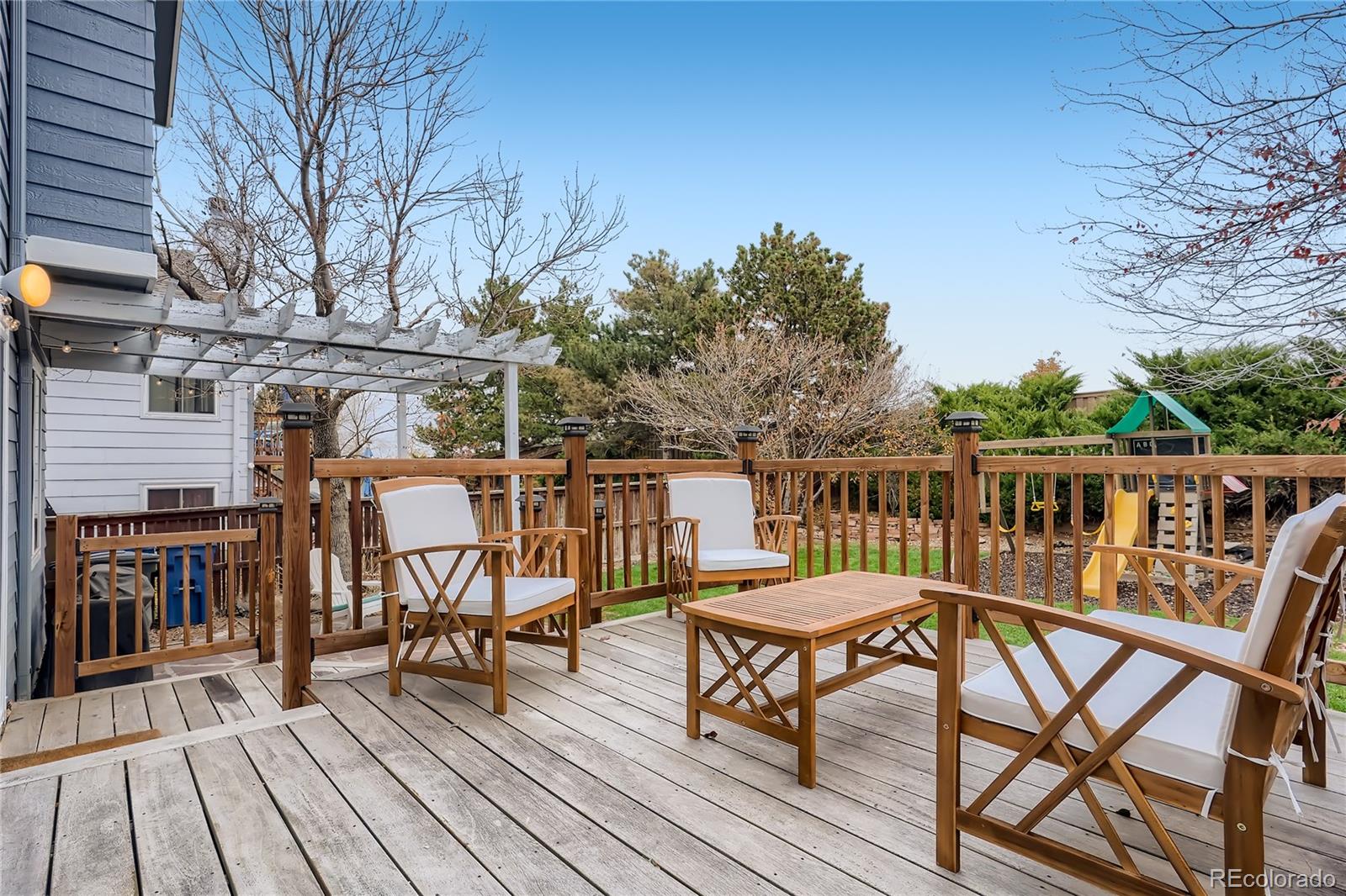 8994 Bermuda Run Circle Highlands Ranch, CO 80130 - Photo 26 of 30 a view of a chairs and table on the wooden floor