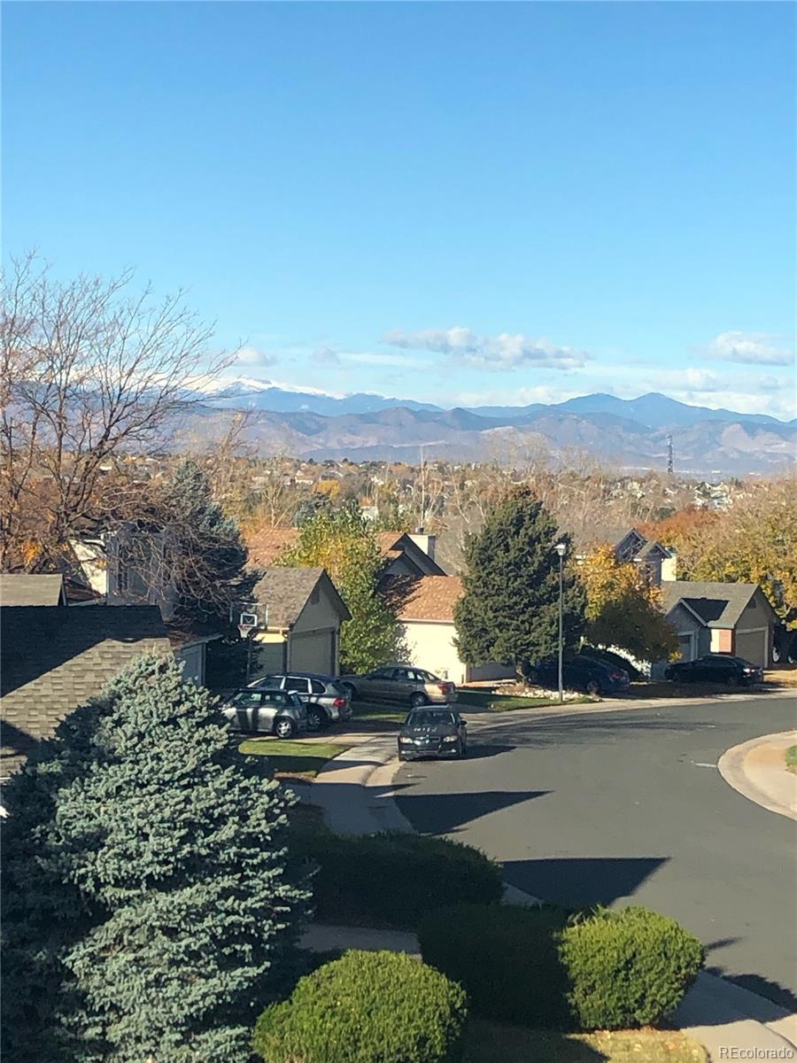 8994 Bermuda Run Circle Highlands Ranch, CO 80130 - Photo 29 of 30 a view of a city with mountains in the background