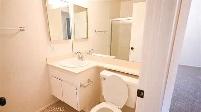 a view of a bathroom from a hallway