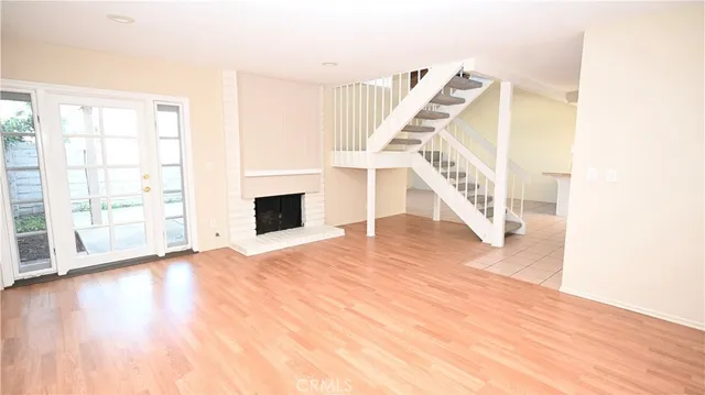 a view of an entryway with wooden floor