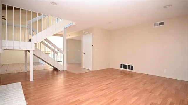 a bathroom with a toilet and a mirror