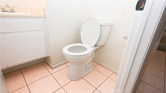 a view of staircase with white walls and a window