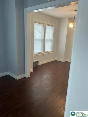 a kitchen with appliances a sink and cabinets