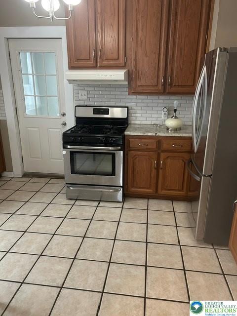 57 East Raspberry Street Bethlehem, PA 18018 - Photo 14 of 34 a kitchen with a stove a sink and a refrigerator