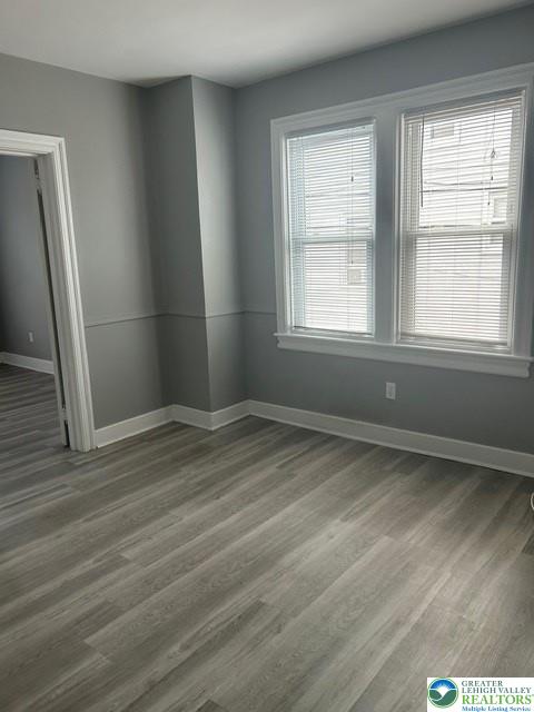 57 East Raspberry Street Bethlehem, PA 18018 - Photo 24 of 34 an empty room with wooden floor and windows