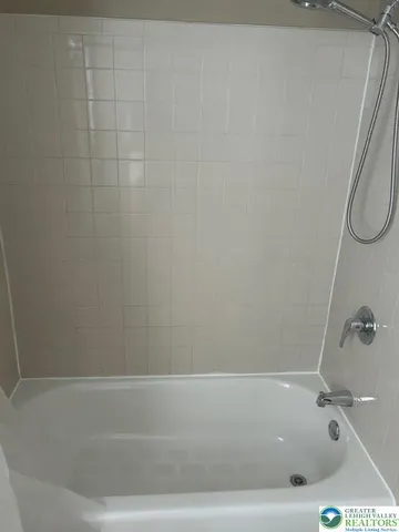 a bathroom with a sink toilet and window