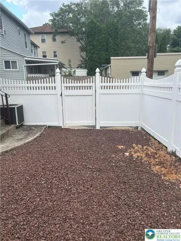 a view of a house with a parking area