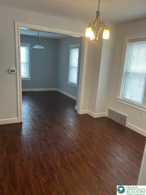 57 East Raspberry Street Bethlehem, PA 18018 - Photo 8 of 34 an empty room with wooden floor and windows