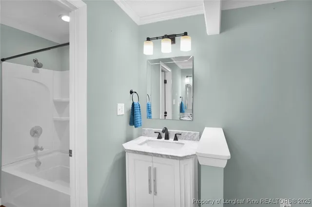 a bathroom with a sink a mirror and a bathtub