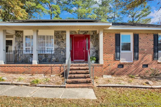 front view of a house with a large window