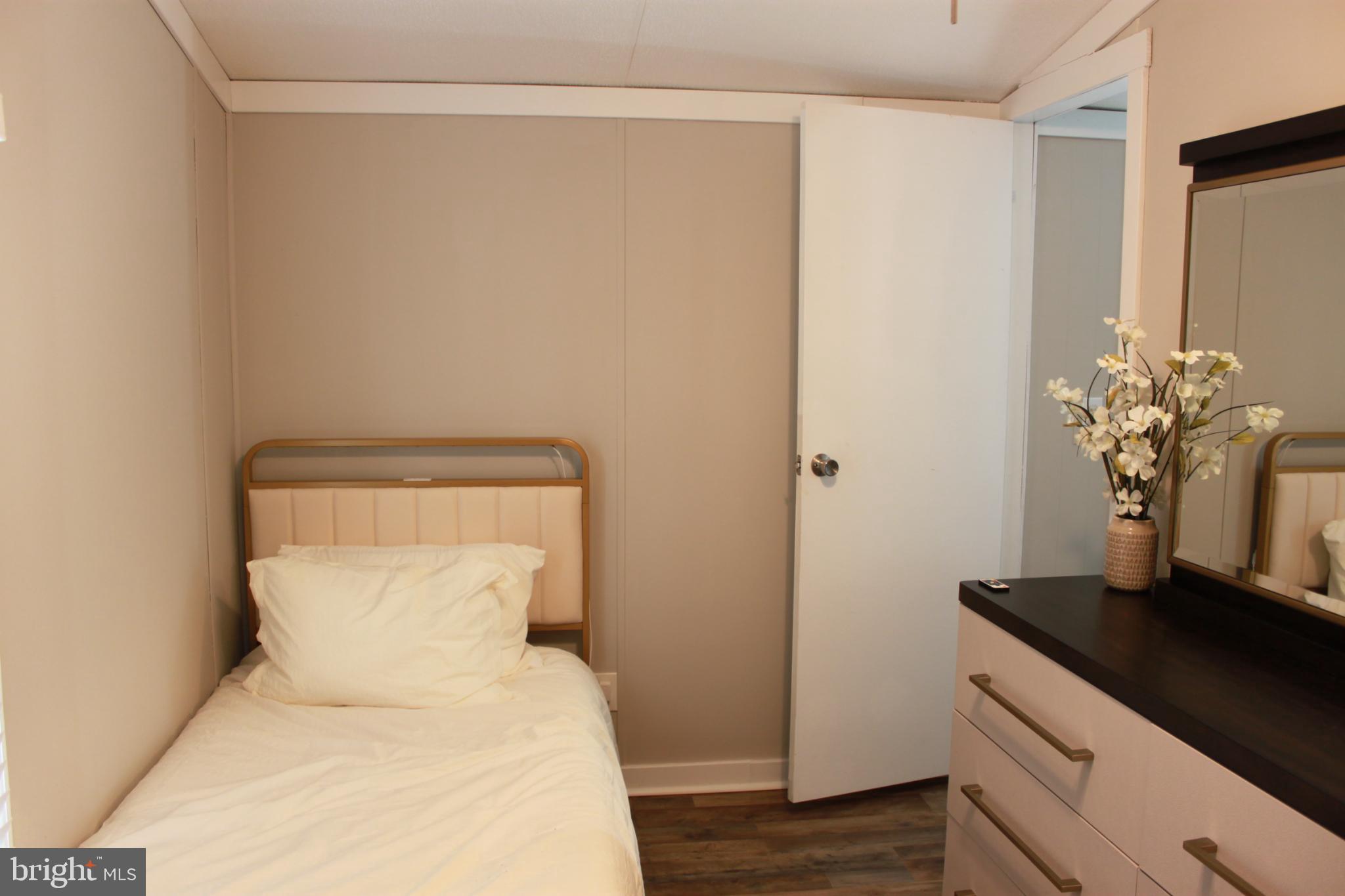 188 Mockingbird Lane Mantua, NJ 08051 - Photo 12 of 17 a bed room with a bed and a potted plant