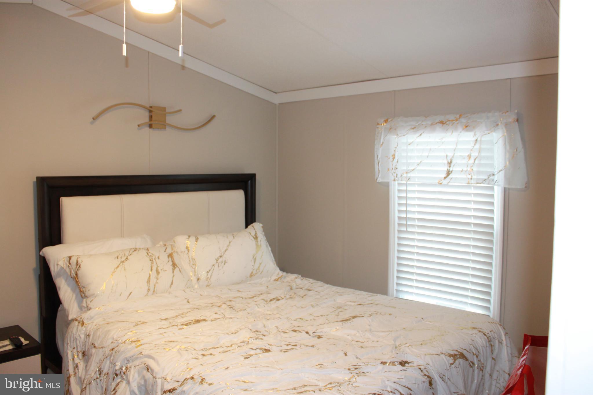 188 Mockingbird Lane Mantua, NJ 08051 - Photo 14 of 17 a large white bed in a white room