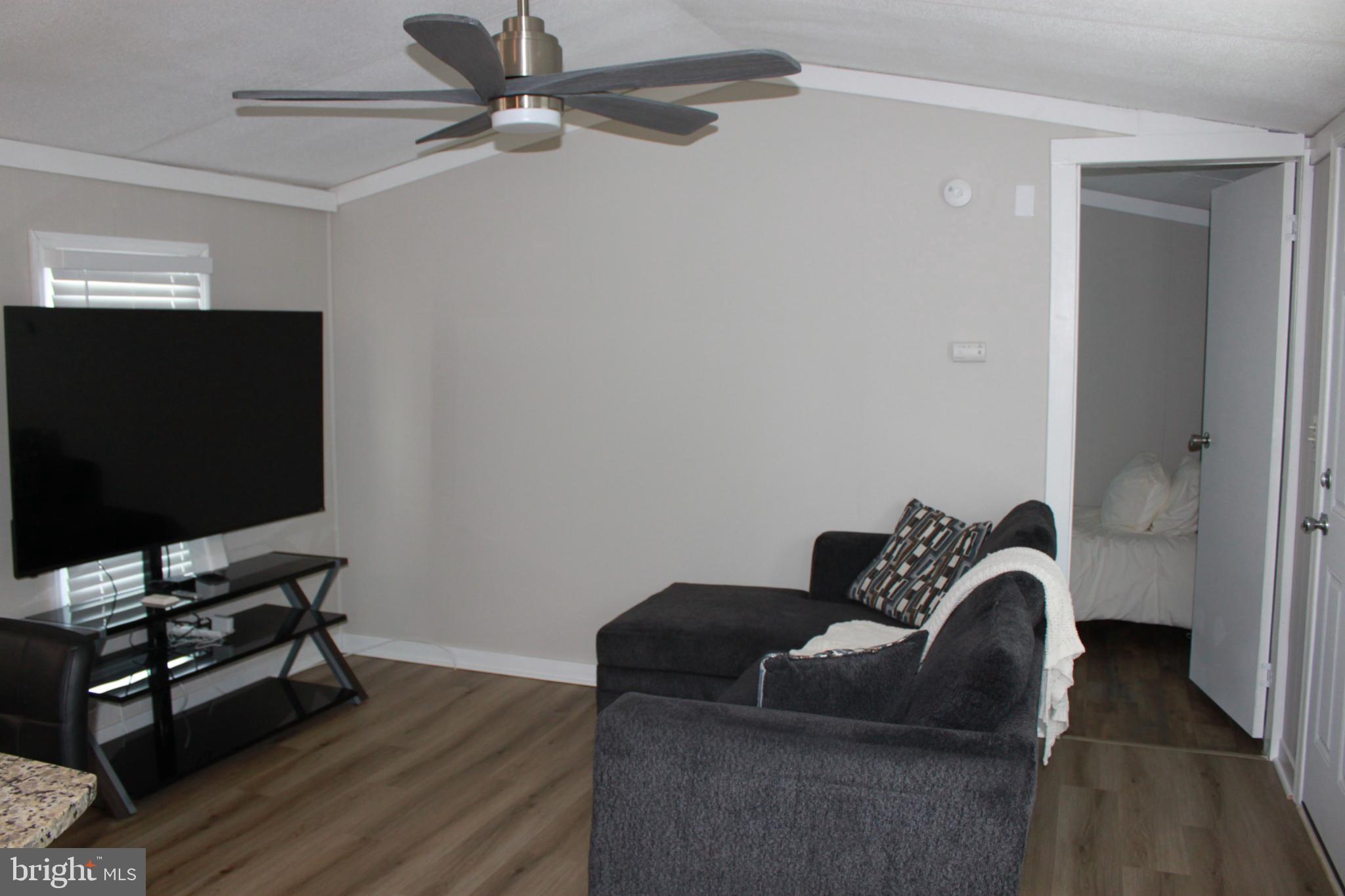 188 Mockingbird Lane Mantua, NJ 08051 - Photo 5 of 17 a living room with furniture and a flat screen tv