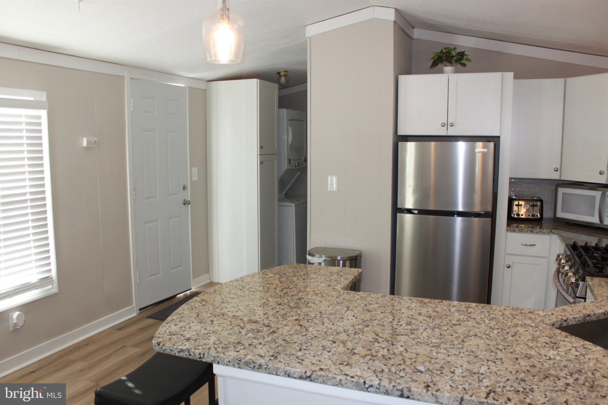 188 Mockingbird Lane Mantua, NJ 08051 - Photo 9 of 17 a kitchen with kitchen island a refrigerator sink and stove