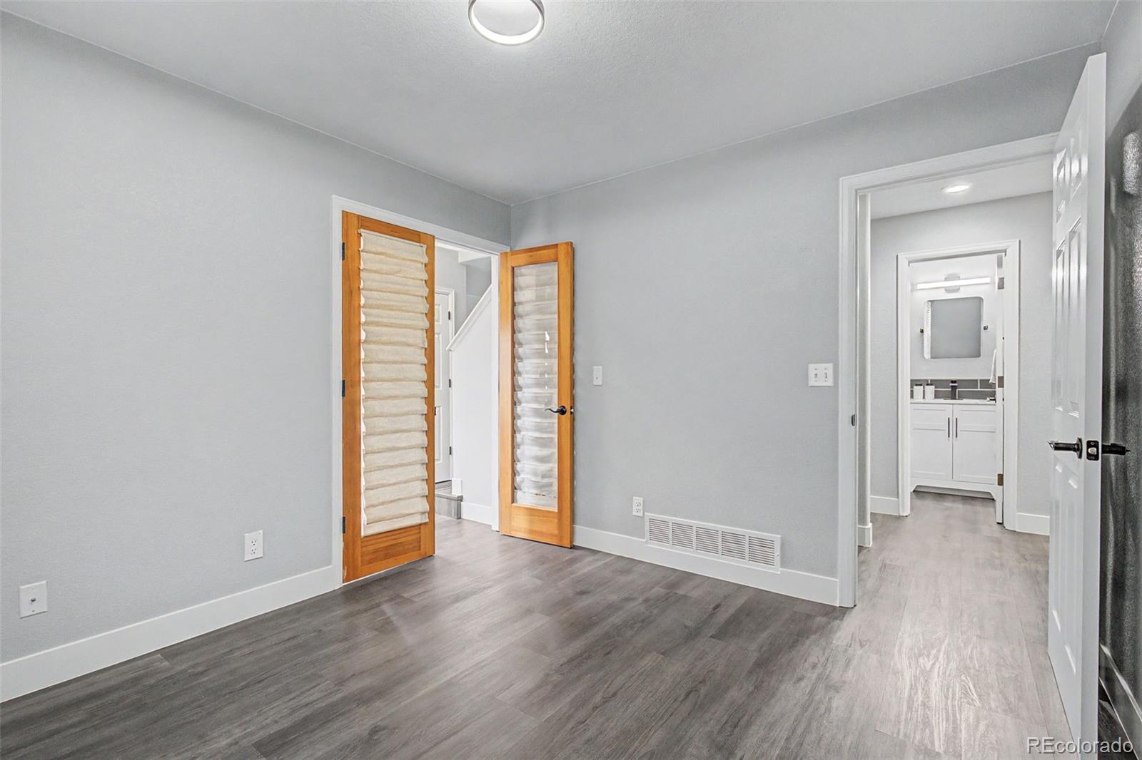 2233 70th Avenue Greeley, CO 80634 - Photo 16 of 50 wooden floor in an empty room