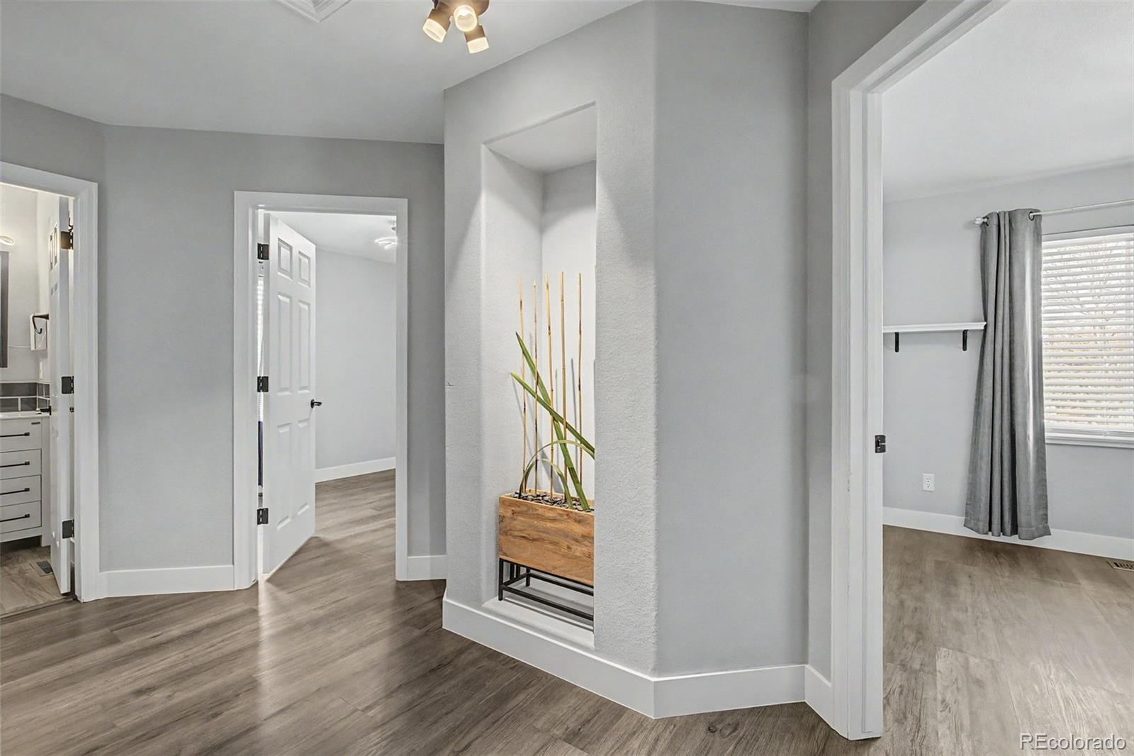 2233 70th Avenue Greeley, CO 80634 - Photo 17 of 50 wooden floor with a mirror in a room