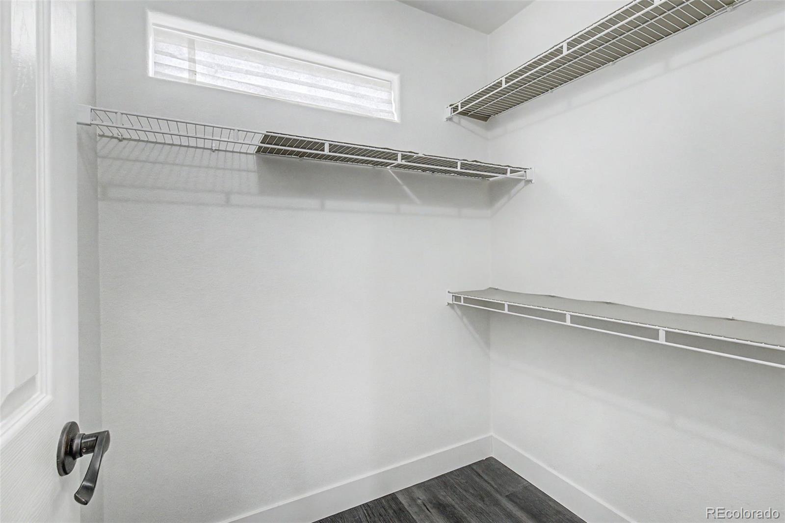 2233 70th Avenue Greeley, CO 80634 - Photo 22 of 50 a view of a room with racks on the wall