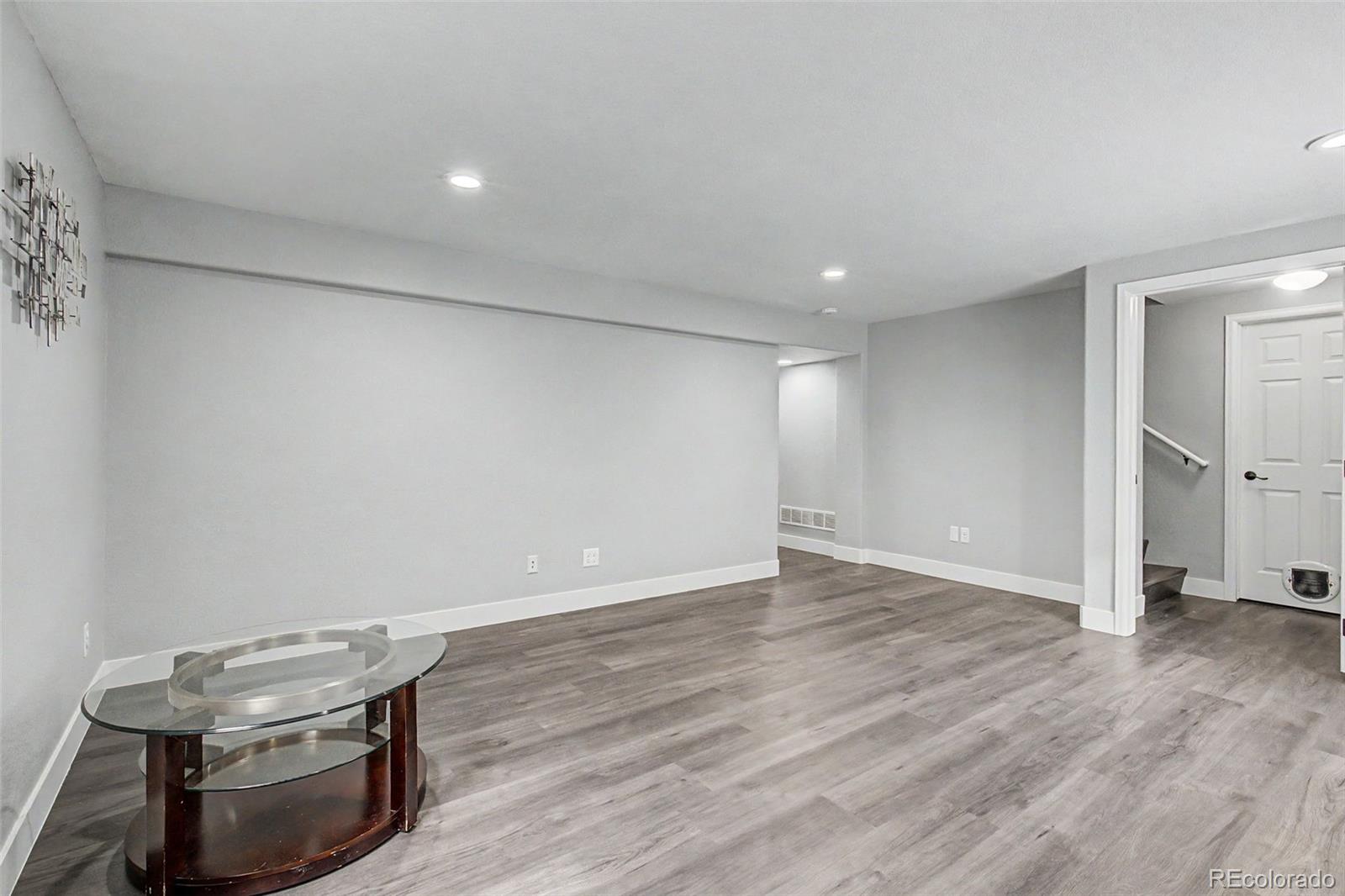 2233 70th Avenue Greeley, CO 80634 - Photo 35 of 50 a view of room with wooden floor