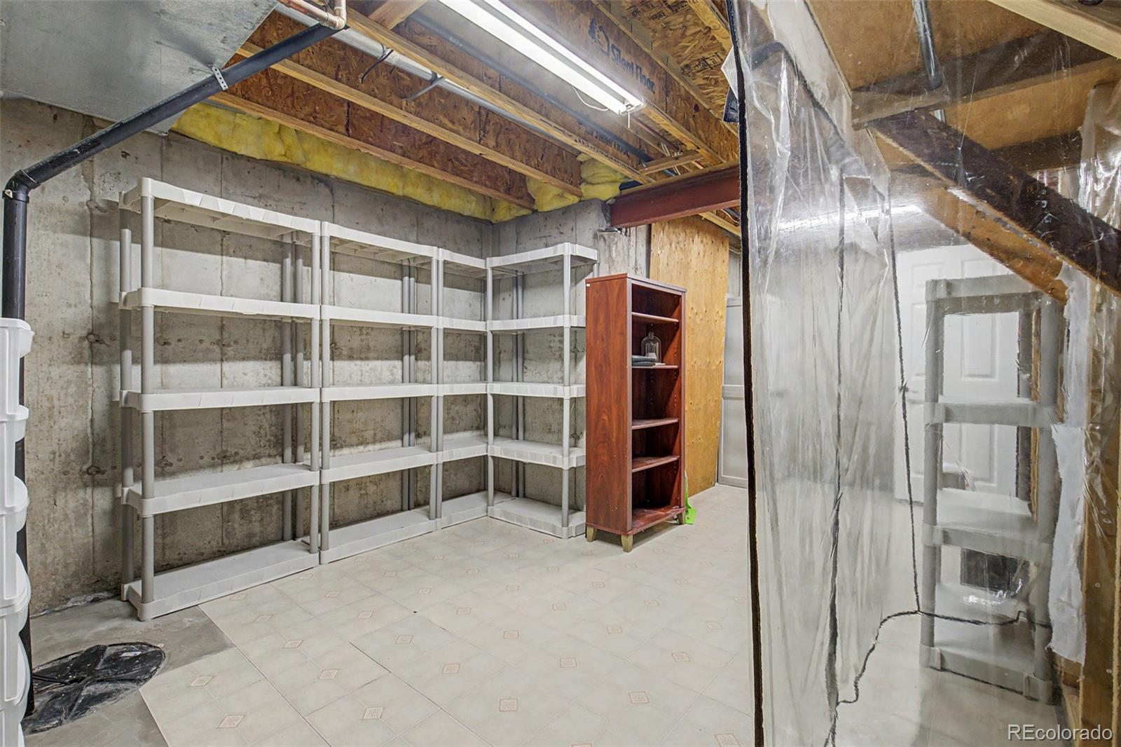2233 70th Avenue Greeley, CO 80634 - Photo 41 of 50 a view of an empty room with a cabinet