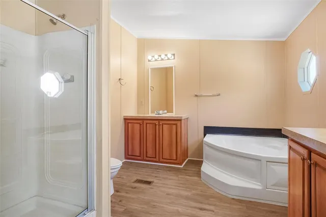 a bathroom with a sink a mirror and a shower