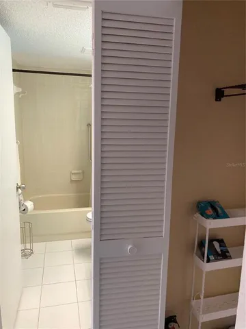 a bathroom with a shower and a sink