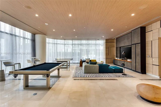a kitchen with kitchen island granite countertop a table and chairs