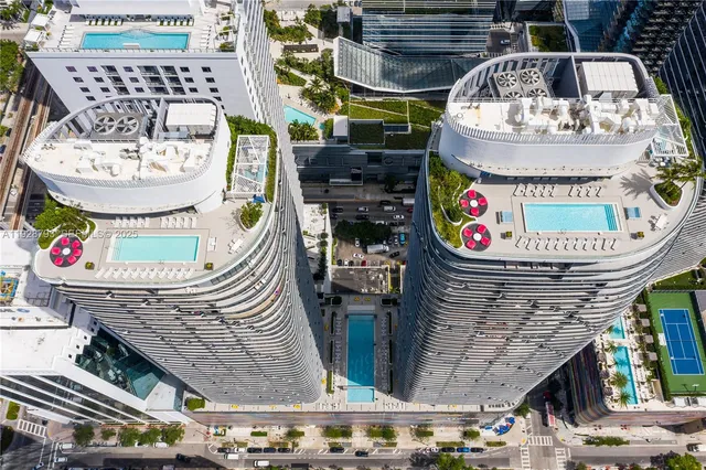 a view of roof deck with outdoor seating and city view