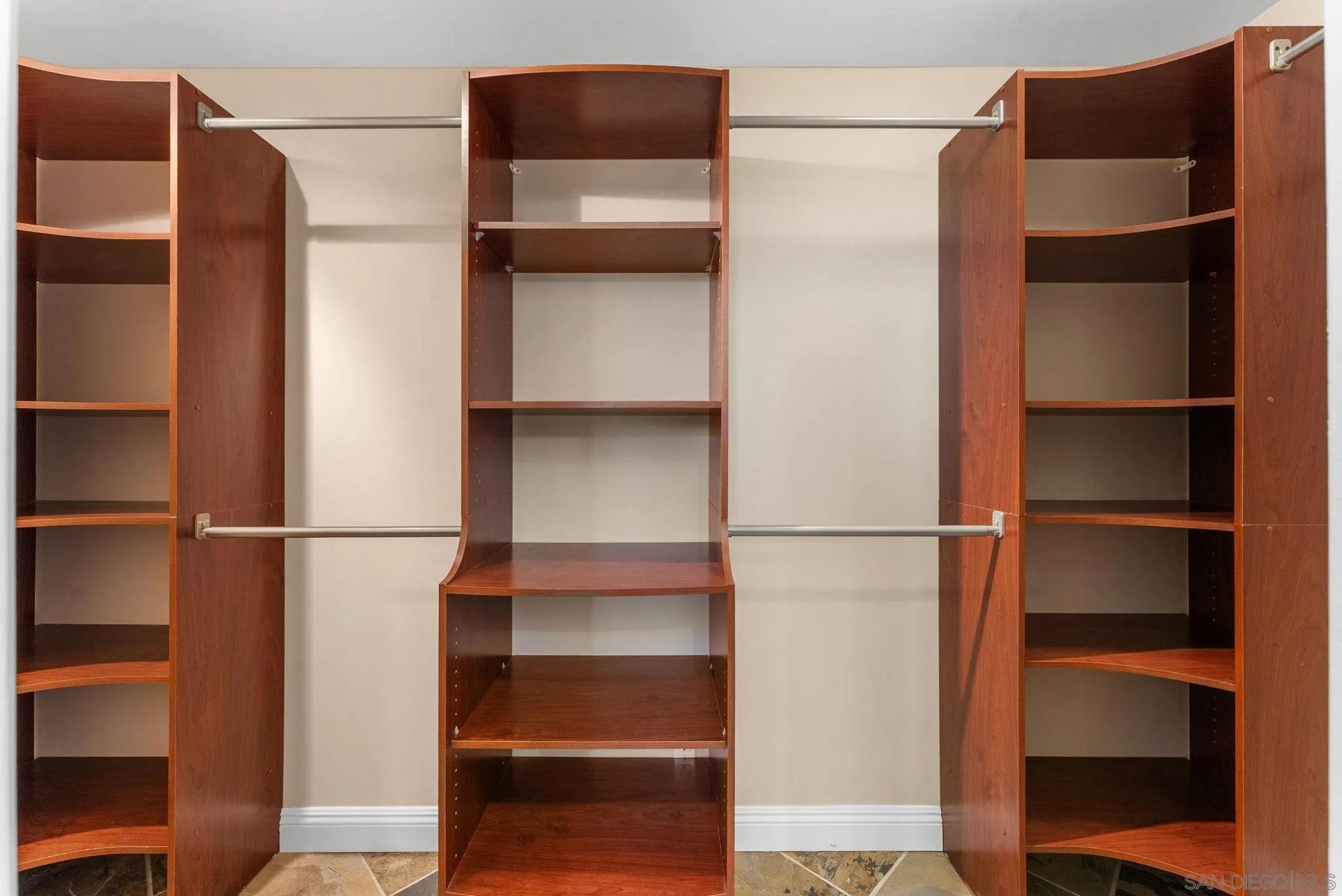 12443 Mirar De Valle Road Valley Center, CA 92082 - Photo 21 of 54 a view of walk in closet with empty racks