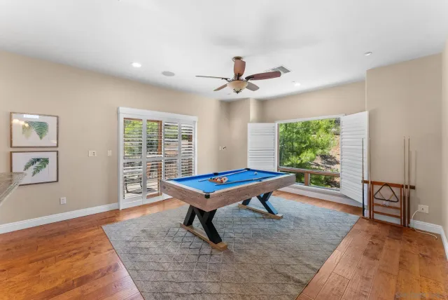 a living room with furniture a window and a rug