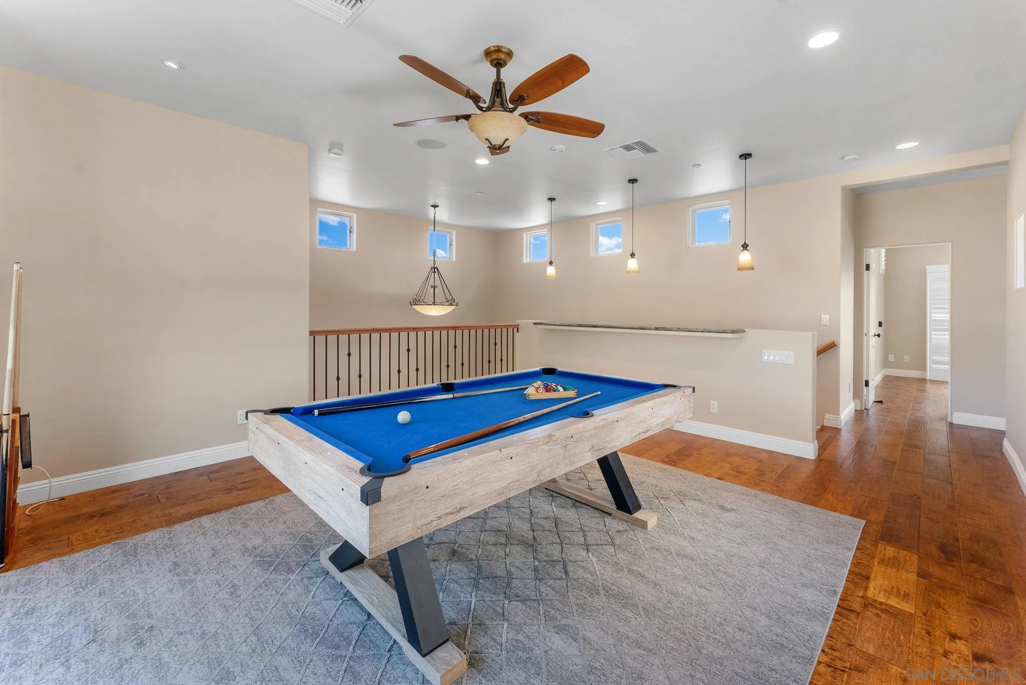 12443 Mirar De Valle Road Valley Center, CA 92082 - Photo 25 of 54 a room with pool table and wooden floor
