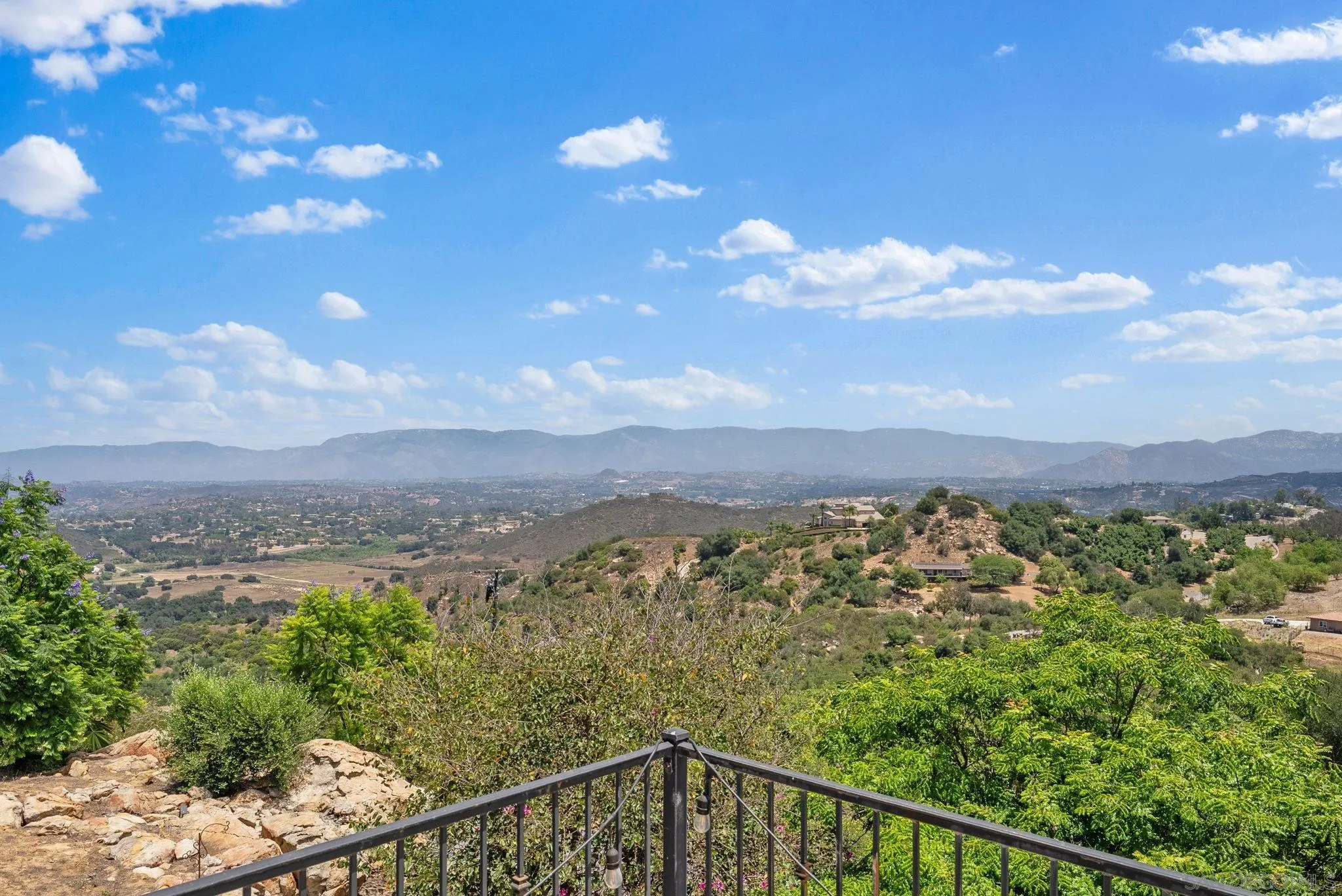 12443 Mirar De Valle Road Valley Center, CA 92082 - Photo 27 of 54 a view of a city with lots of trees