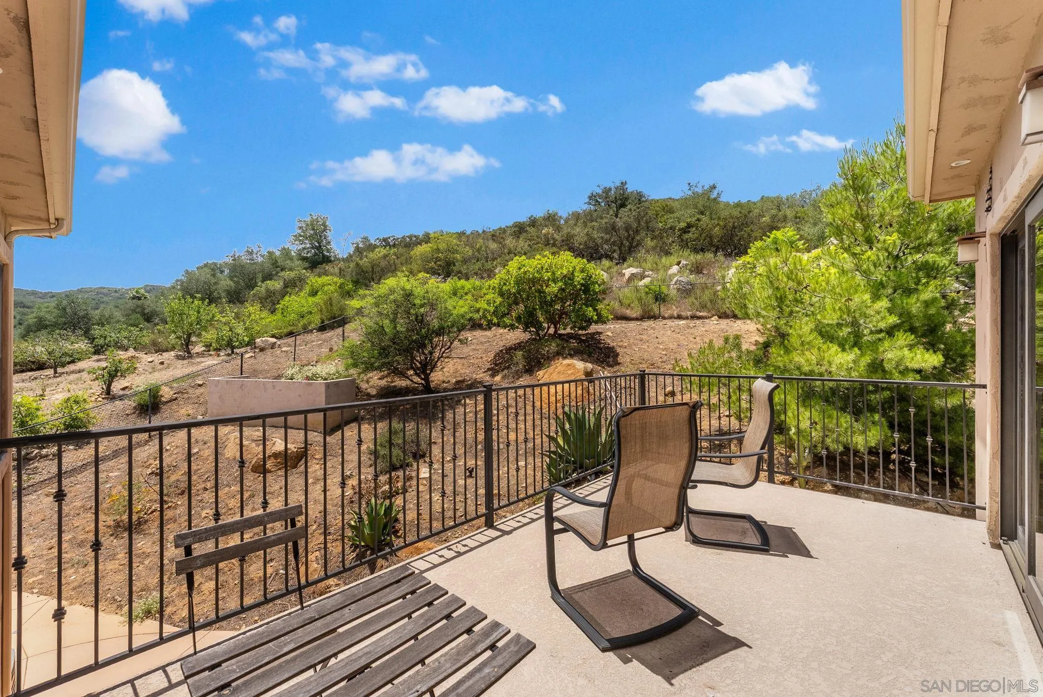12443 Mirar De Valle Road Valley Center, CA 92082 - Photo 30 of 54 a view of a chairs and table in the balcony