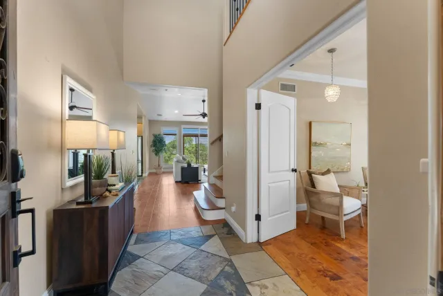 a living room with furniture and a view of bathroom