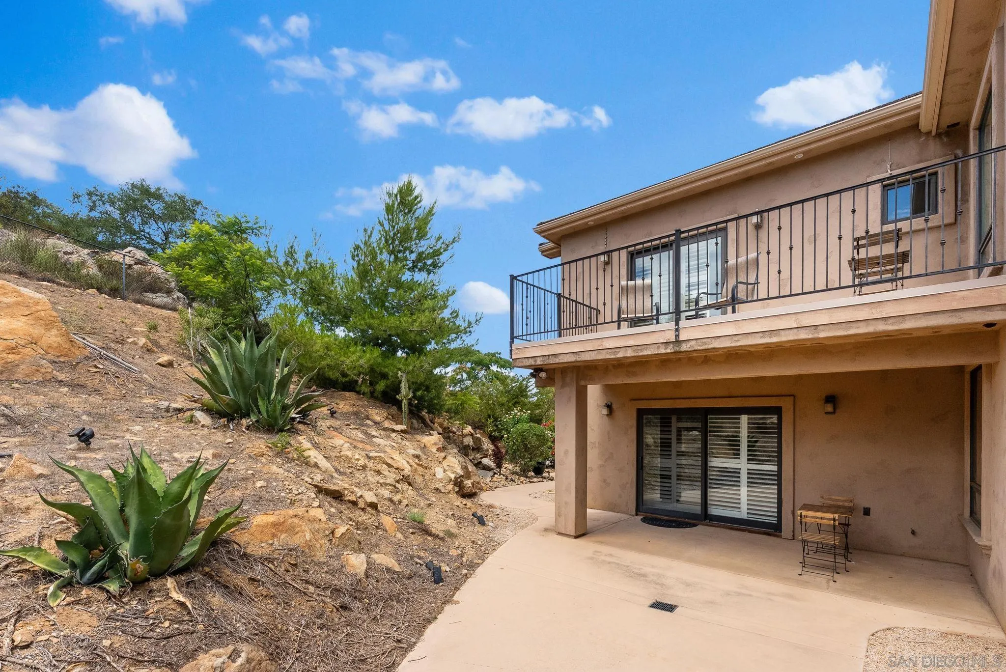 12443 Mirar De Valle Road Valley Center, CA 92082 - Photo 34 of 54 a front view of a house with a yard