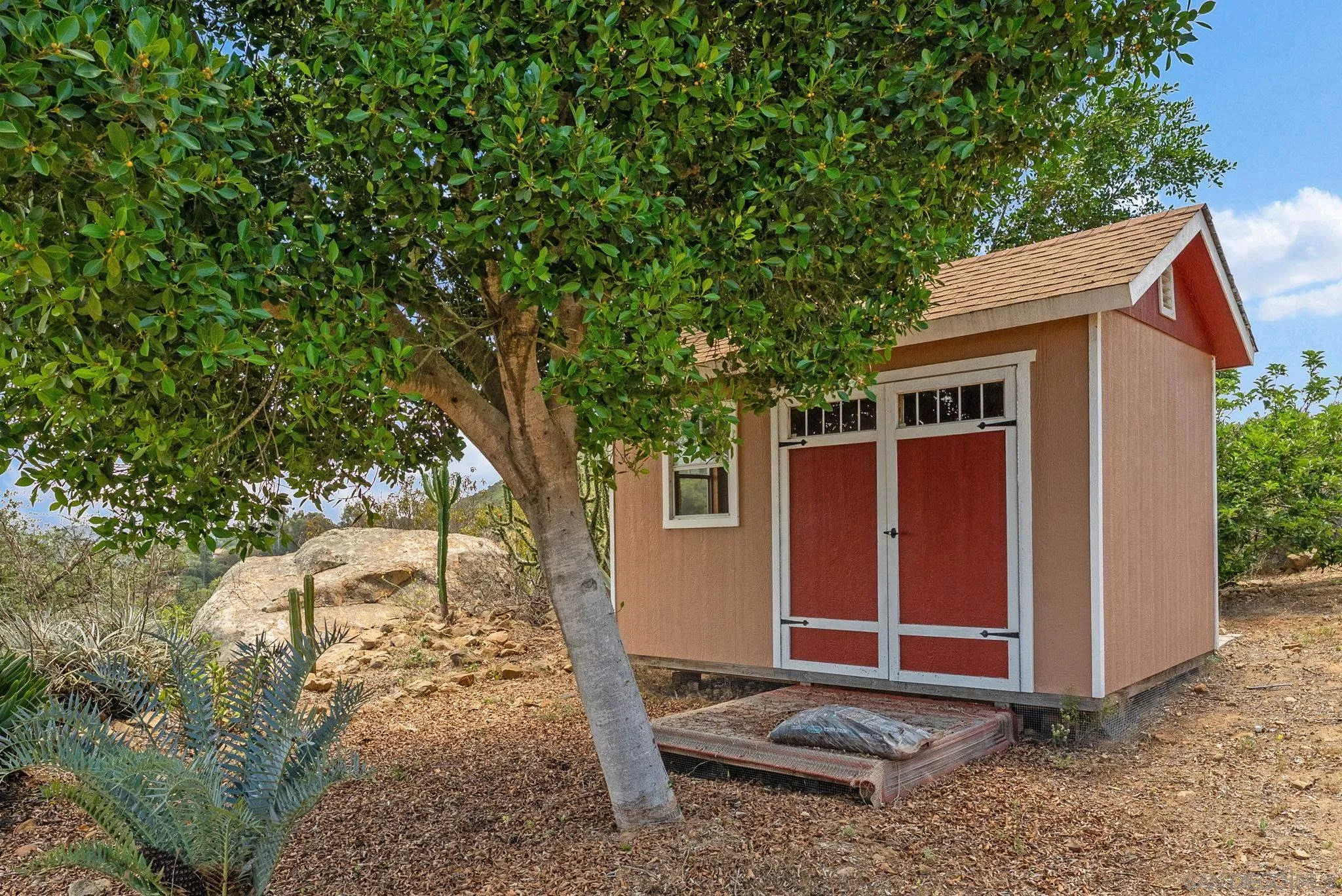 12443 Mirar De Valle Road Valley Center, CA 92082 - Photo 37 of 54 a backyard of a house with barbeque oven