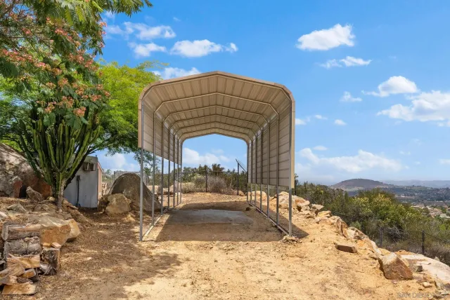 a view of a pathway both side of house