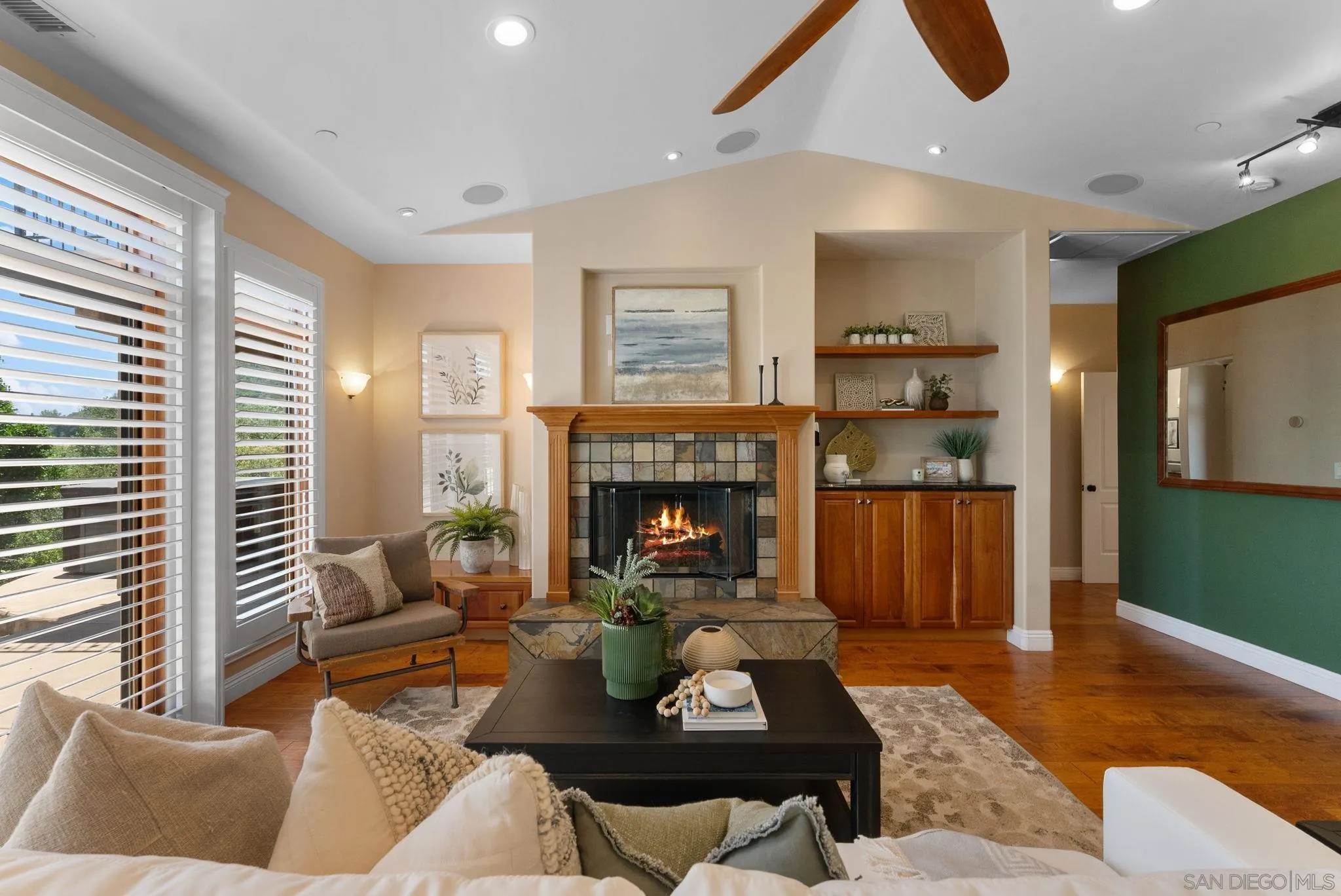 12443 Mirar De Valle Road Valley Center, CA 92082 - Photo 5 of 54 a living room with furniture and a fireplace