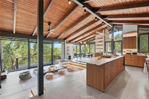 a kitchen with a large window and a counter space