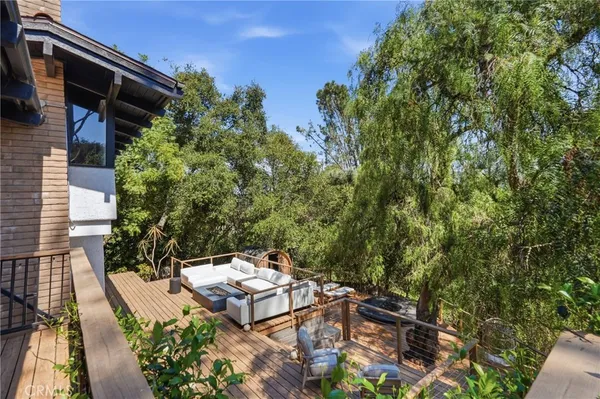 a view of a backyard with sitting area