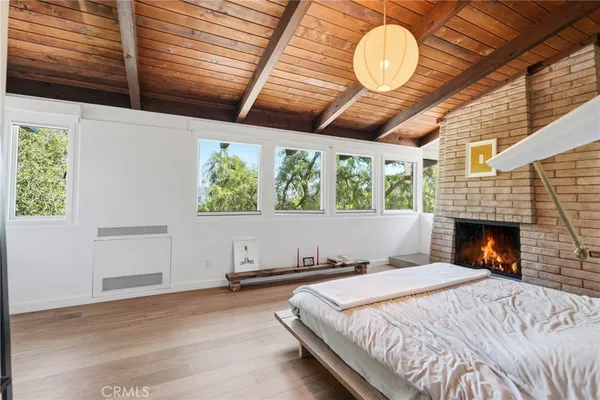 a bed room with a bed and a fireplace