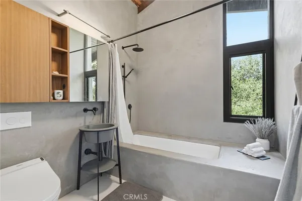 a living room with furniture and large window