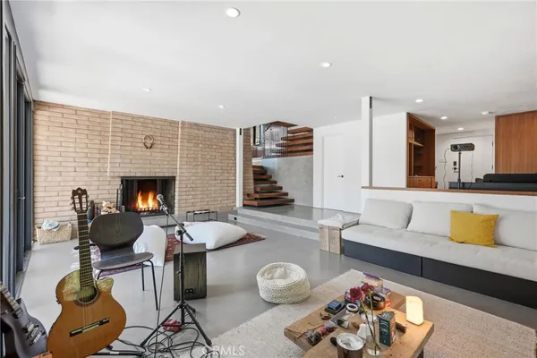 a bathroom with a double vanity sink a toilet and a glass door shower